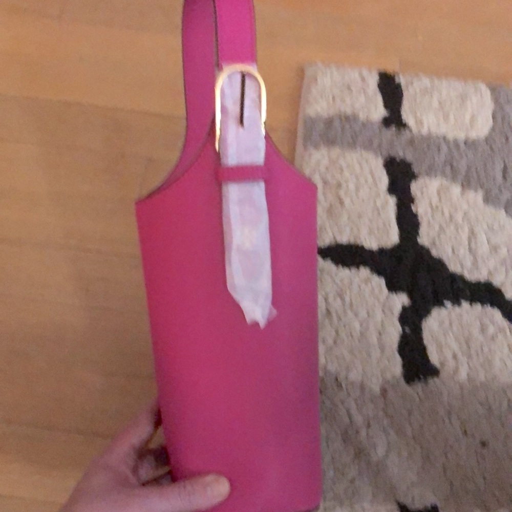 Tory Burch hot pink leather wine bottle tote.